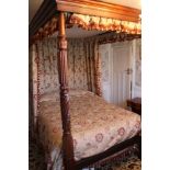 George IV-style mahogany four poster bed with stepped canopy on turned and reeded lappet supports