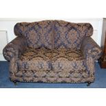 Pair of modern twin seater sofas with navy upholstery with repeat acanthus design,