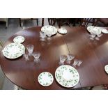 Georgian-style three pedestal mahogany dining table with four extra leaves,