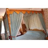 Antique pine four poster double bed with panelled head and footboard and turned supports,