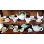 Collection of Belleek porcelain teawares including three teapots,