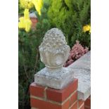 Set of fourteen antique-style concrete pineapple form finials, on square plinths,