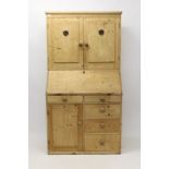 Antique pine two height dresser with cupboards over sloping fall the base with five drawers and