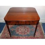 George III mahogany tea table with reeded edging, on ring turned legs,