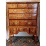 Early Eighteenth century walnut and feather-banded chest of three short and three long graduated