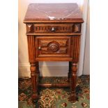Late nineteenth century French walnut bedside cupboard with rouge marble top over a frieze drawer