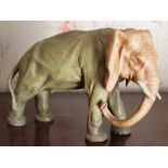 Early twentieth century Royal Dux-style porcelain figure of an elephant, impressed marks to foot,