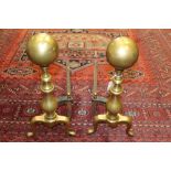 Pair of brass and wrought iron fire dogs, urn-form uprights with ball terminals,