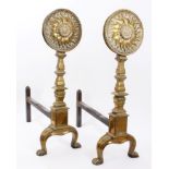 Pair of impressive Arts & Crafts brass andirons with sunflower terminals,