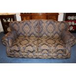 Modern three seater sofa with navy upholstery with repeat acanthus design,