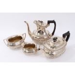 Edwardian four piece silver teaset with half reeded bodies and gadrooned borders,