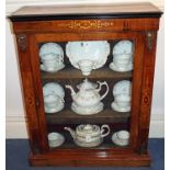 Late Victorian walnut and inlaid pier cabinet enclosed by glazed door, on plinth vase,