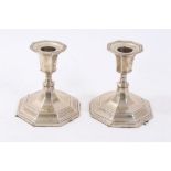 Pair of George V silver candlesticks of dwarf octagonal form, London 1915),