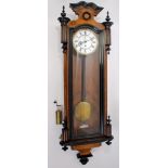 Late 19th / early 20th century walnut and ebonised Vienna wall clock with white enamelled dial,
