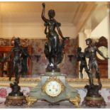 Early twentieth century French green onyx and spelter clock garniture with figure surmounts,