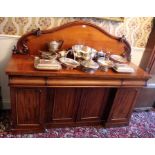 Early Victorian mahogany sideboard with arched gallery back above three cushion-moulded frieze