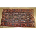 Antique Persian rug, the wavy field with repeat flower-head motif in meander foliate main border,