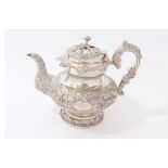 Good quality William IV Irish silver teapot with all-over ornate repoussé floral and scroll