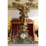 Early twentieth century French green onyx and gilded spelter clock garniture surmounted by a female