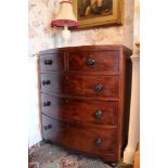 Early Victorian mahogany bow front chest of two short and three long drawers with carved bun