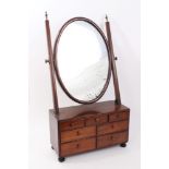 George III dressing table mirror with oval swing plate and seven short drawers