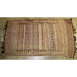 Good antique Kelim rug in russet tones with multiple geometric bands and main geometric border,