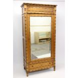 Victorian pine wardrobe enclosed by mirror door with drawer below,