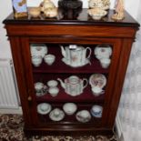 Late nineteenth century inlaid walnut pier cabinet with fabric-lined interior enclosed by single