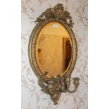 Pair of Victorian gilt framed girandole mirrors with oval bevelled plate,