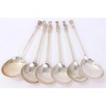 Set of four 19th century white metal apostle spoons each stamped W to bowl,