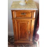 Pair of early twentieth century French walnut bedside cupboards with marble tops above a single