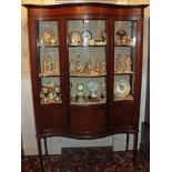 Edwardian inlaid mahogany serpentine fronted display cabinet, enclosed by single door,
