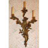 Pair of nineteenth century rococo-style three branch gilt metal wall sconces,
