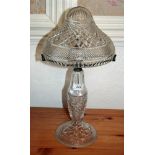 Early twentieth century cut glass table lamp with domed shade on flared column and circular base,