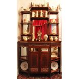 Edwardian mahogany chiffonier with mirrored and shelved back above frieze drawer and panelled doors
