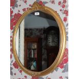 Pair of Victorian oval gilt framed wall mirrors with shell cresting and beaded borders,
