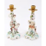 Pair of 18th century and later ormolu mounted figural candlesticks, probably Derby,