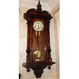 Early twentieth century walnut cased Vienna wall clock with glazed door and twin chain movement,