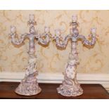 Pair of Dresden-style figural three branch candelabra with foliate scrolling ornament,