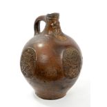 Fine 17th century Rhenish stoneware Bellarmine wine bottle with bearded mask to neck, loop handle,