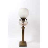 Early 20th century Corinthian column form brass oil lamp with etched globular glass shade and