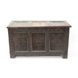 17th century carved oak coffer with three-panel top and front carved with initials and date - A.H.