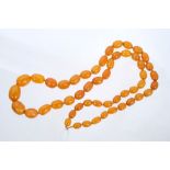 Old amber bead necklace with a long string of graduated 'butterscotch' amber beads measuring