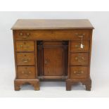 Good mid-18th century mahogany kneehole desk with moulded top and extensively fitted frieze drawer,
