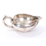 Imperial Russian silver cream jug of compressed circular form,
