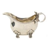 Late 19th century German silver sauce boat of inverted helmet form, with beaded border,