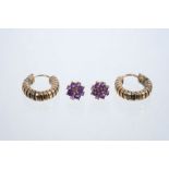 Pair of 9ct gold and amethyst cluster earrings and a pair of yellow metal hoop earrings