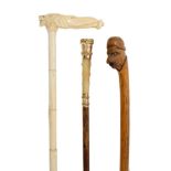 Late 19th century carved ivory walking stick with carved elephant and lion-head handle and