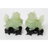 Pair of Chinese carved jade lidded vessels, each in the form of a temple dog, with removable head,