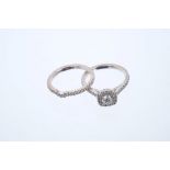 Diamond cluster ring, the cushion shape cluster with a round brilliant cut diamond to the centre,